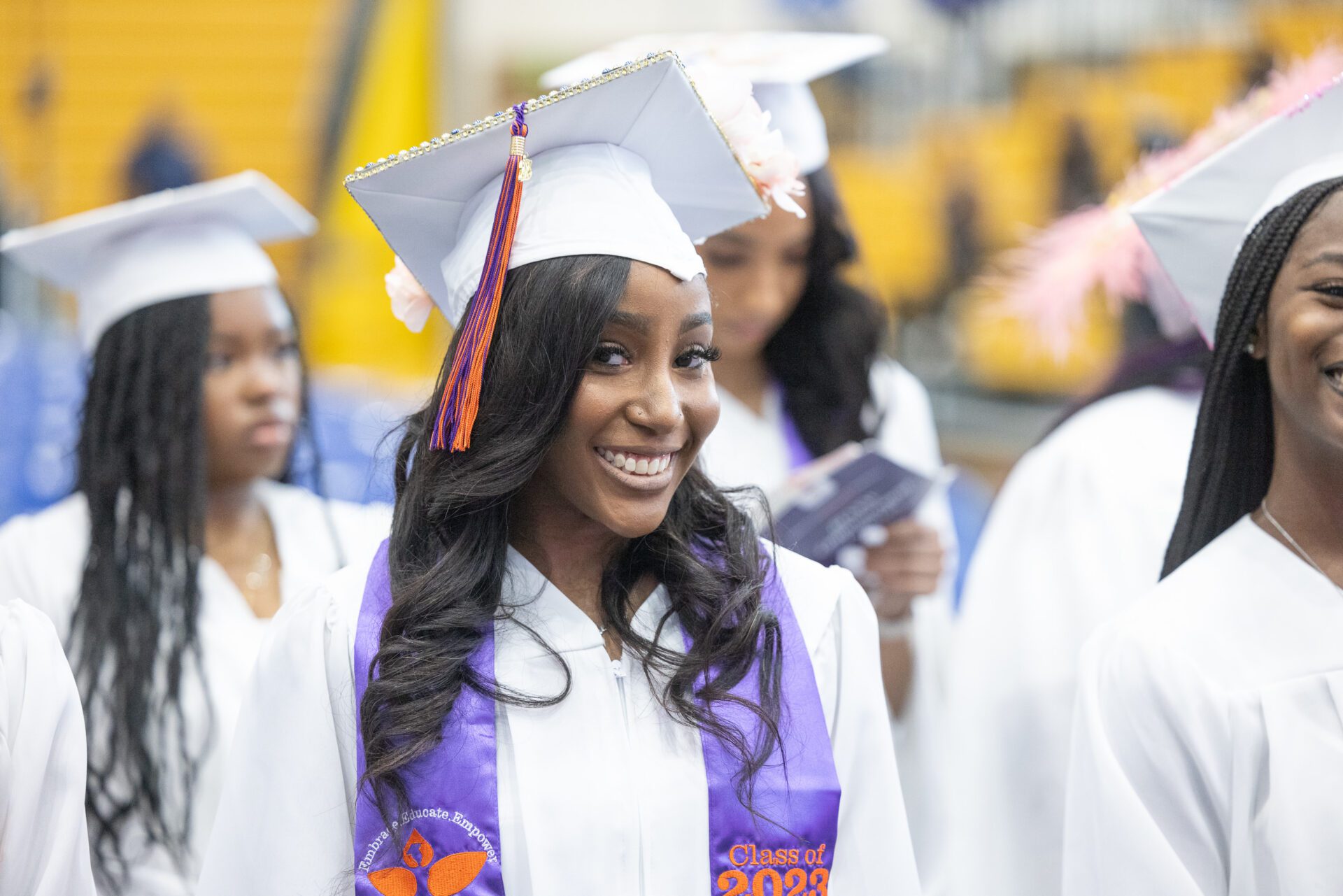 Graduation concept with girl holding her diploma